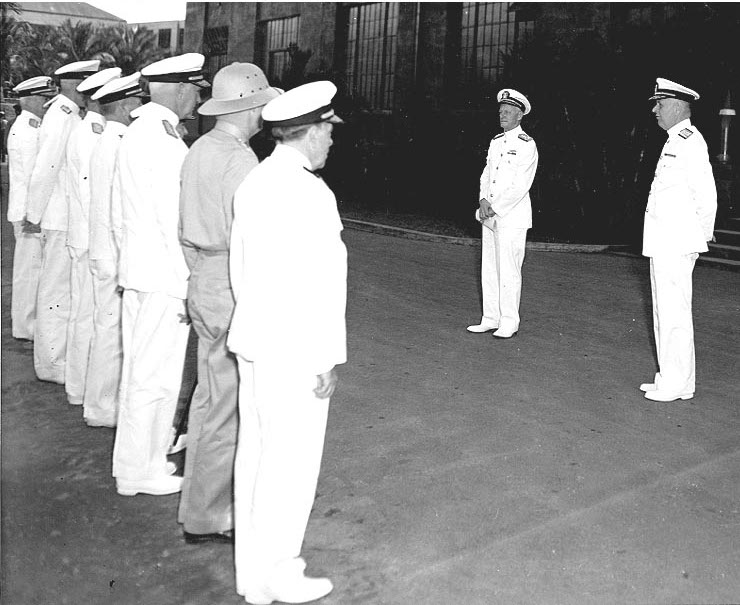 Admiral Nimitz addressing officers after assuming command of US Pacific Fleet, Pearl Harbor, 31 Dec 1941; Admiral Kimmel at right (US Naval History and Heritage Command: NH 62021)