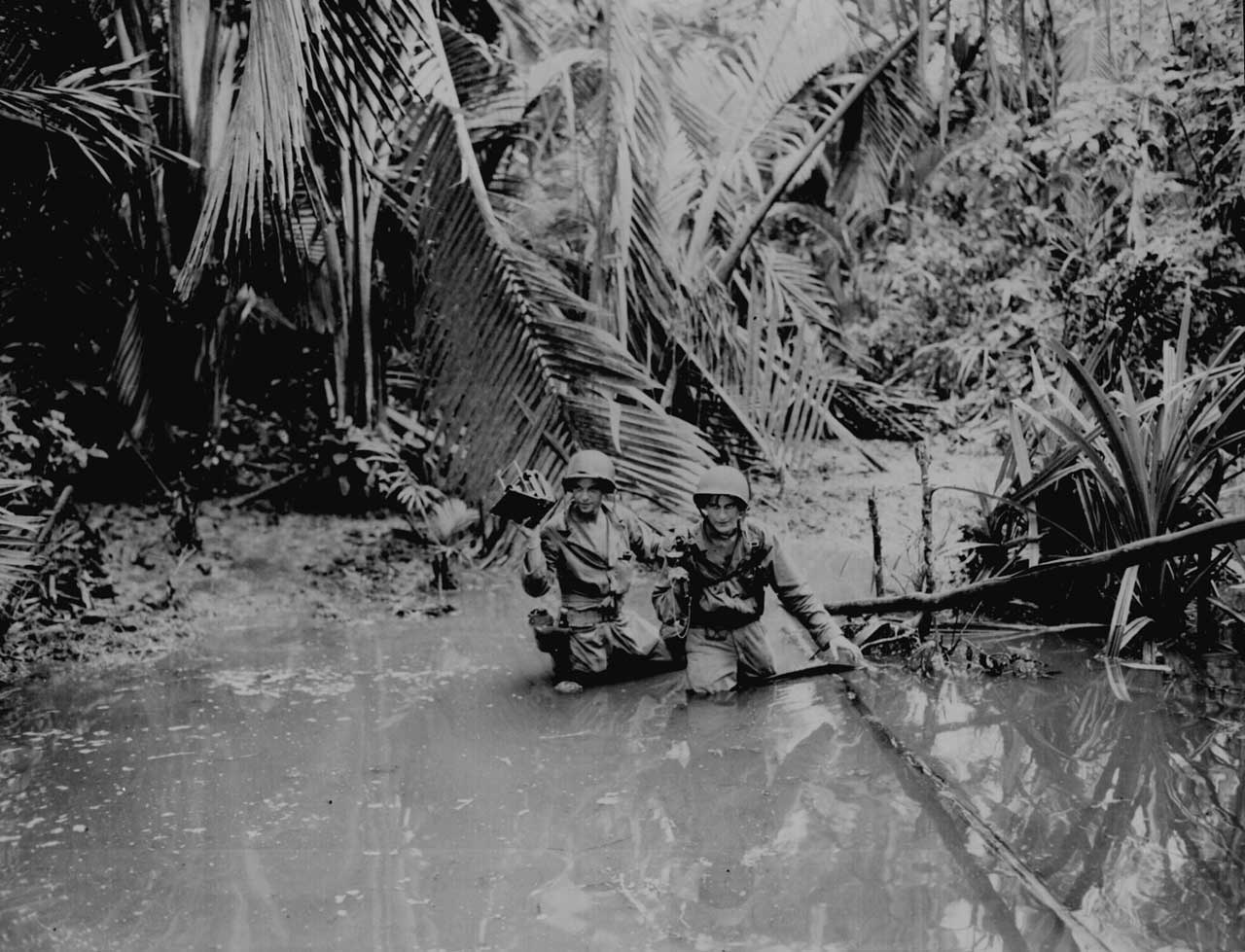 US Signal Corps cameramen Carl Weinke and Ernest Marjoram at Hollandia, New Guinea, 22 Apr 1944 (US National Archives)