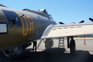 Close-up view of Collings Foundation B-17G Nine-O-Nine, showing (L to R) the waist guns (center) and ball turret (below), open bomb bay doors, top turret. Buchanan Field, Concord, CA, June 2013 (Photo: Sarah Sundin)