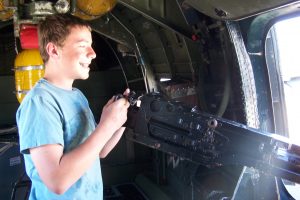 My youngest son manning the waist gun in the Collings Foundation B-17G Nine-O-Nine, Buchanan Field, Concord, CA, June 2013 (Photo: Sarah Sundin)