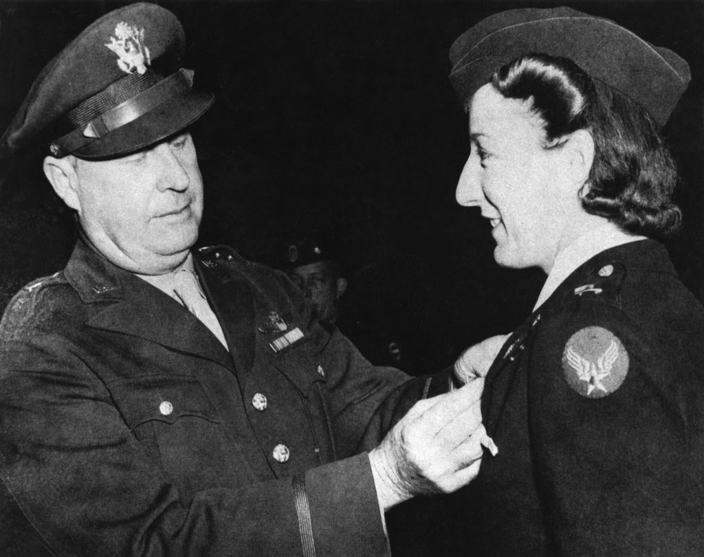 Brig. Gen. Fred Borum presents the Air Medal to Lt. Elsie Ott, the first woman to receive the Air Medal. (US Air Force photo)