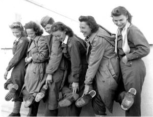 Flight nurses of the 807th MAETS show their worn-out shoes after their two-month trek through Albania, 9 January 1944 (US Air Force photo)