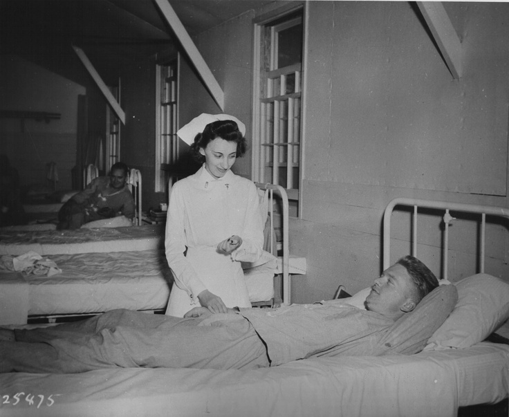 Army nurse attending patient, Camp Forrest, Tullahoma, TN, 22 Sept. 1941 (US Army Medical Dept.)