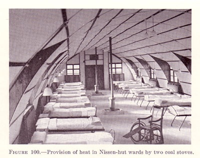 Nissen-hut hospital in England. Note coal stoves in center (US Army Medical Dept.)
