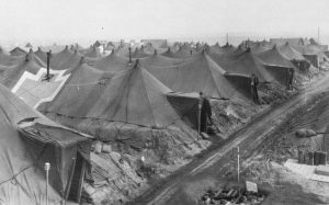 US evacuation hospital tents on the Anzio beachhead, Italy, spring 1944, revetted for protection from bombs and shells (US Army Medical Dept.)