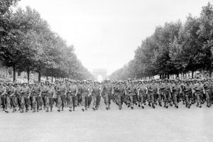Troops of the US 28th Infantry Division march down the Avenue des Champs-Élysées, Paris, 29 Aug 1944 (US National Archives)