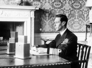 King George VI of the United Kingdom delivering his radio address announcing Britain’s entry into the war with Germany, Buckingham Palace, London, Sept 3, 1939 (United Kingdom National Archives)