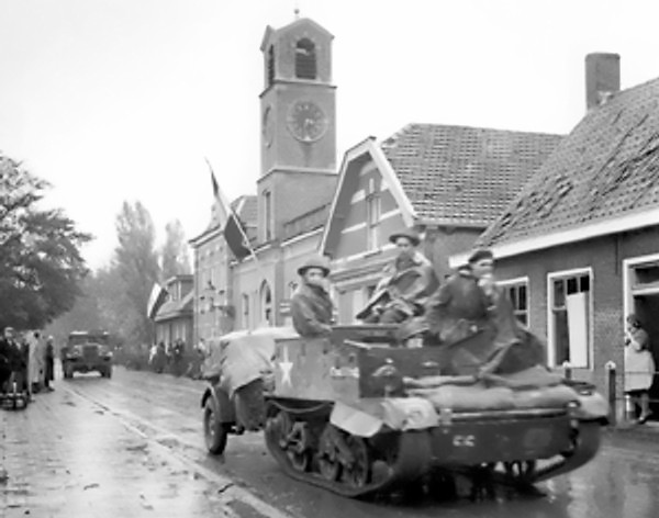 Canadian Royal Hamilton light infantry carriers in Dutch village of Krabbendijke on the Beveland Causeway, 27 Oct 1944 (Library and Archives Canada: PA-205125)