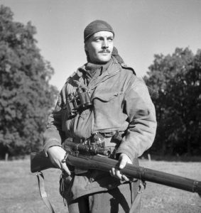 Canadian Calgary Highlanders Sniping Platoon Sergeant Harold A. Marshall posing with his Lee-Enfield No. 4 Mk. I rifle, Kapellen, Belgium, 6 Oct 1944 (Library and Archives Canada: 3206370)