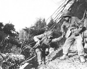 US soldiers struggling up a hill in the Hürtgen Forest, 1944 (US Army Center of Military History)