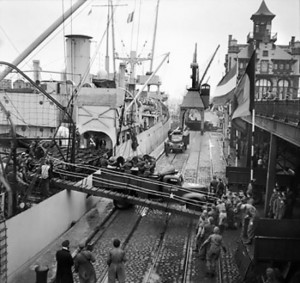 Oil being unloaded from SS Fort Cataraqui at Antwerp, 30 Nov 1944, the first ship to berth at the port after Allied takeover (Imperial War Museum)