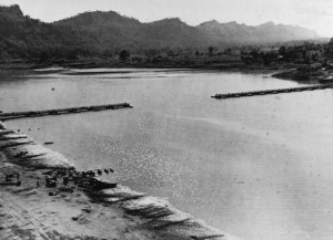 The 1,154-ft ft bridge across the Chindwin River in Burma as it neared completion; this would be the longest Bailey Bridge ever, 2 Dec 1944. (Imperial War Museum)