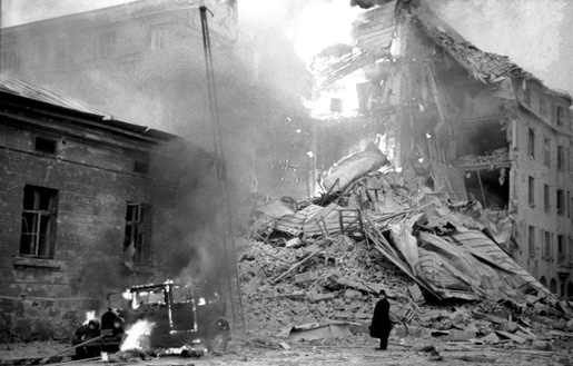 Burning building in Helsinki, Finland after Soviet bombing, 30 November 1939 (public domain via WW2 Database)