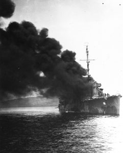 USS Ward on fire after being struck by a Japanese kamikaze in Ormoc Bay, Philippines, 7 Dec 1944, three years to the day after she fired the first US shot of the Pacific War (US Navy photo 80-G-270773)