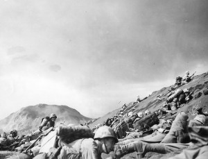 Men of USMC 5th Division advancing through the volcanic ash hills of Red Beach No. 1 at Iwo Jima, 19 Feb 1945 (US Naval History and Heritage Command)