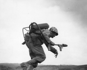 Man of US 9th Marines with flamethrower, Motoyama Airfield Number 2, Iwo Jima, Feb 1945 (US Naval History and Heritage Command)