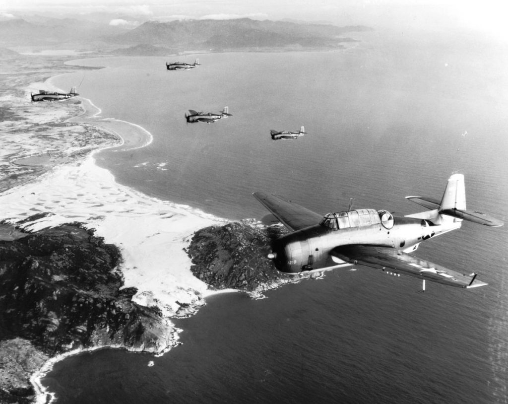 TBM-1C Avengers of Torpedo Squadron 4 from carrier USS Essex crossing the Indochinese coast on their way to bomb shipping at Saigon, 12 Jan 1945 (US Navy photo: 80-G-300673)