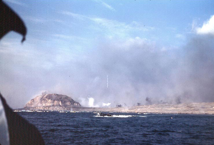 Landing craft underway off Iwo Jima's eastern shore during the initial day of landings, 19 Feb 1945 (Photographer: Howard Whalen; US Naval History and Heritage Command: NH 104322-KN)