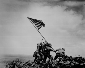 Raising the US flag atop Mount Suribachi, by Joe Rosenthal, Iwo Jima, 23 Feb 1945. (US National Archives: 80-G-413988)