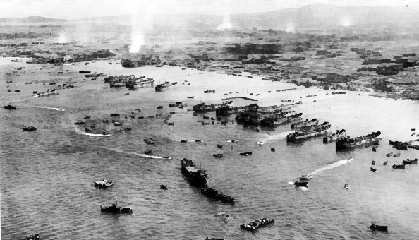 American ships unloading supplies on the beach of Okinawa, Japan, 4 Apr 1945 (US Army photo)
