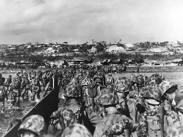 Men of the US Tenth Army landing on Okinawa, Japan, 1 Apr 1945 (US National Archives: 39573-FMC)