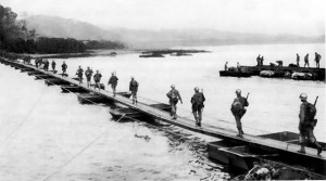 US Army soldiers crossing the Machinato Inlet on foot bridge, Okinawa, 19 Apr 1945 (US Army photo)