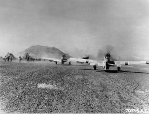 P-51D Mustangs of the US 47th Fighter Squadron on Iwo Jima prepare for raid on Chichi Jima, Mar 15, 1945; Mt. Suribachi in background (US Army Air Force photo)