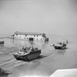'Fantails' or Buffalo amphibians transport German prisoners through a flooded landscape south of Comacchio Lagoon, Italy, 11 April 1945 (Imperial War Museum: NA 23992)