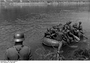 German troops crossing the Meuse River in a rubber raft, near Aiglemont, France, 14 May 1940 (German Federal Archive, Bild 146-1971-088-63)