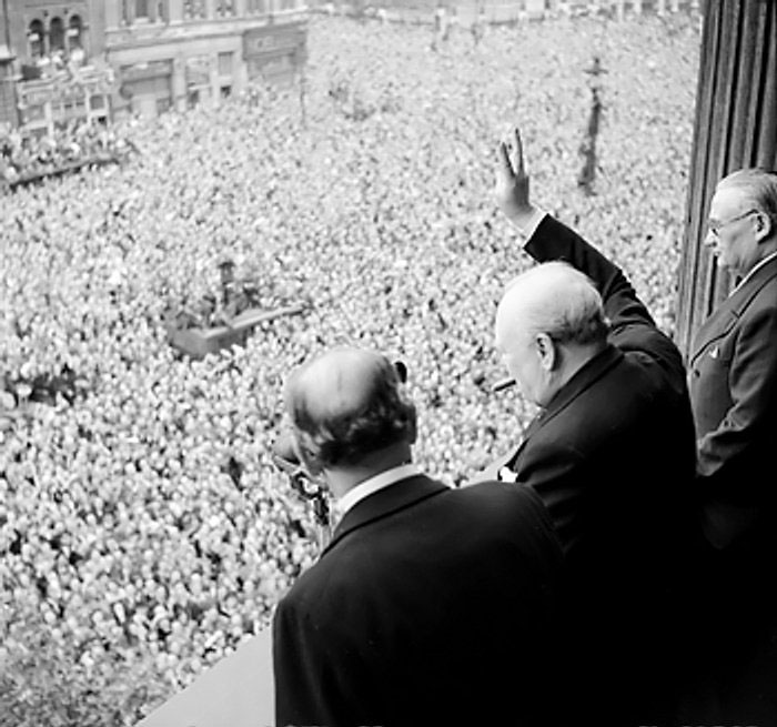 Churchill waving to crowds at Whitehall, London, on the day the war with Germany was won, 8 May 1945 (Imperial War Museum: 4700-37 H 41849)