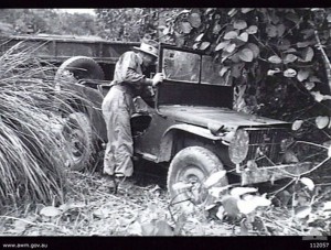 Australian Army Lieutenant MG Searles, 2/25 infantry battalion, inspecting a Japanese vehicle found abandoned near Balikpapan, Borneo, 22 Jul 1945. (Australian War Memorial 112057)