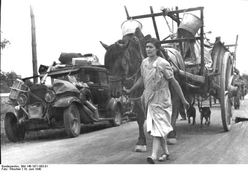 French refugees on a road near Gien, France, 19 Jun 1940. (German Federal Archive: Bild 146-1971-083-01)