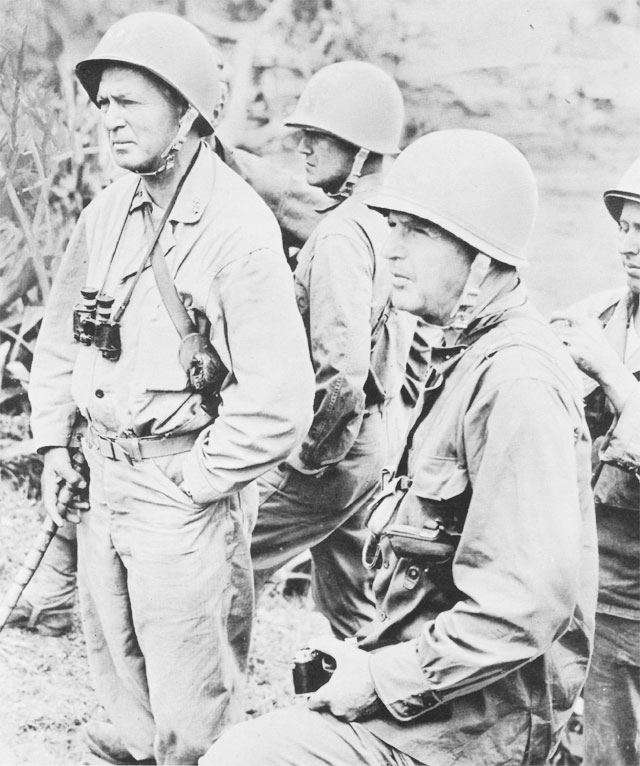 Lt. Gen. Simon B. Buckner, Commanding General, US Tenth Army (right, with camera) and Maj. Gen. Lemuel C. Shepperd, Jr., Commanding General, 6th Marine Division, Okinawa (with walking stick), June 1945 (US Army Center of Military History)