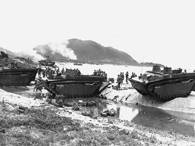 Amphibious tractors delivering US Marines and supplies on the beach of Iheya Shima, 3 Jun 1945 (US National Archives: 126988)