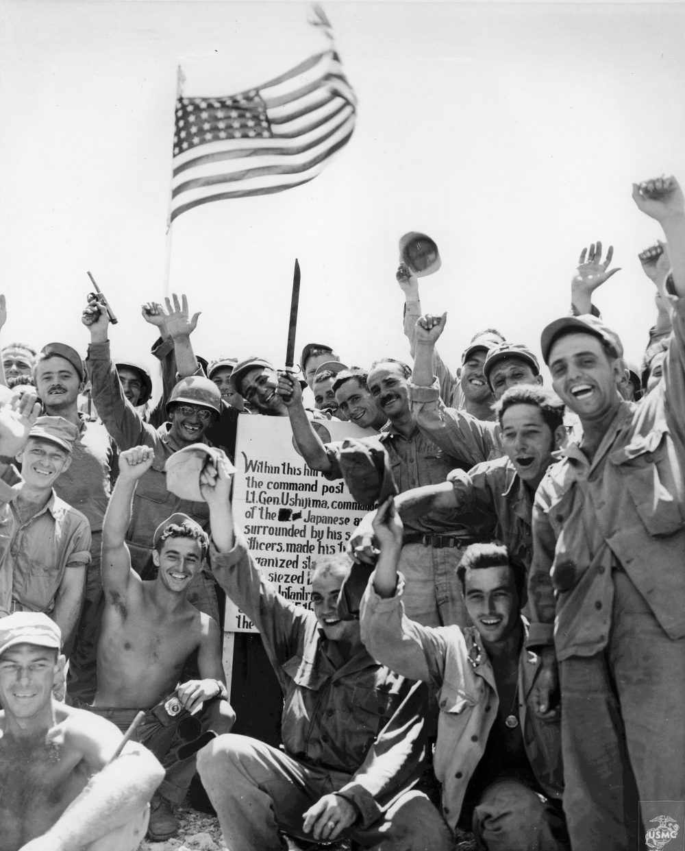 US Marines and US Army soldiers celebrating the capture of Hill 89, Okinawa, Japan, 27 Jun 1945; the hill was captured by US 7th Inf Div on 21 Jun 1945. (US Marine Corps photo)