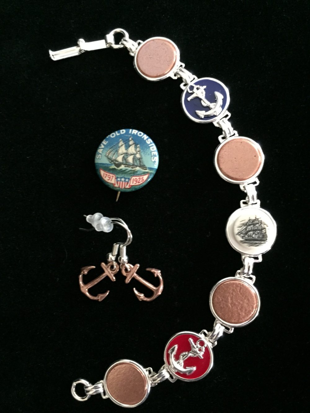 Jewelry made from copper reclaimed from restoration of USS Constitution, plus a button from the 1925 restoration fund drive. (Photo: Sarah Sundin)