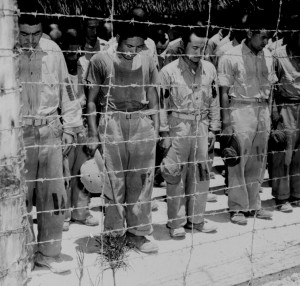 Japanese POWs at Guam listen to Emperor Hirohito’s surrender announcement, 15 Aug 1945 (US National Archives: 80-G-490320)