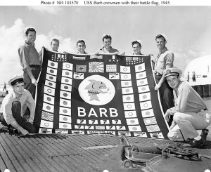 Members of USS Barb’s demolition squad, Pearl Harbor, August 1945. These men went ashore at Karafuto, Japan, and planted an explosive charge that wrecked a train. This raid is represented by the train symbol in the middle bottom of the battle flag. (US Navy photo: NH 103570)