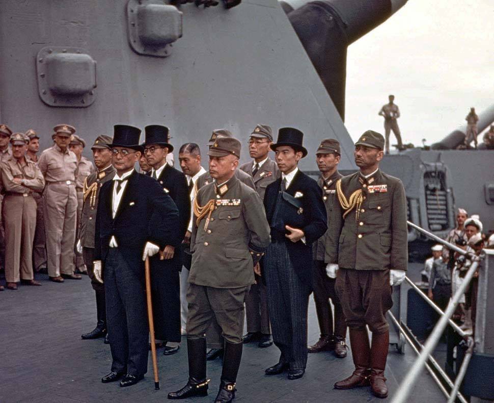 The Japanese delegation arriving aboard USS Missouri, Tokyo Bay, for the surrender ceremony, 2 September 1945 (US National Archives: USA C-2719)