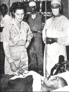 Hideki Tojo being treated by US medical personnel in Tokyo, Japan after his failed suicide attempt, 11 September 1945 (public domain via WW2 Database)