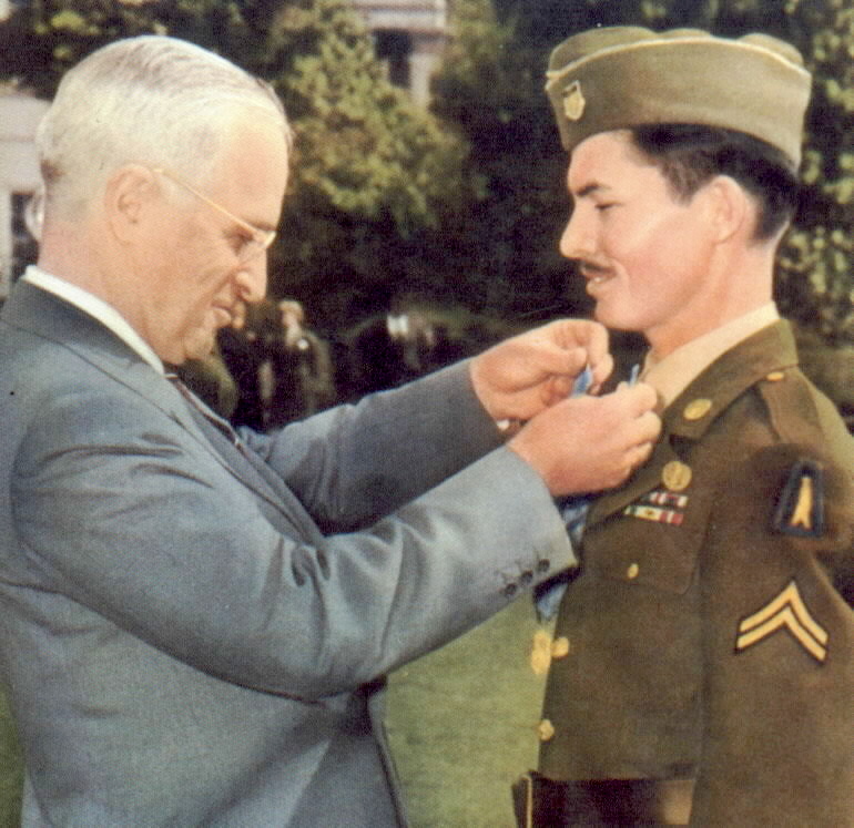 President Harry Truman awarding the Medal of Honor on conscientious objector Desmond Doss, 12 October 1945 (US government photo)