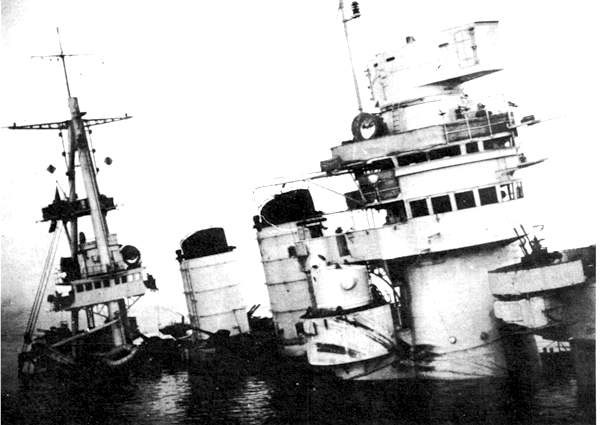 Italian battleship Conte di Cavour sinking in Taranto harbor, November 1940 (public domain via WW2 Database)