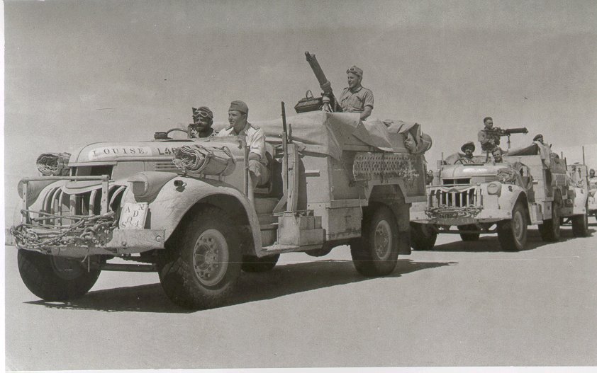 Two Long Range Desert Group trucks armed with water cooled Vickers guns (British government photo)