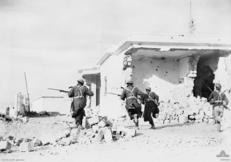 Australian troops rushing through the streets of Bardia, Libya, 4 Jan 1941 (Australian War Memorial: 006083) 