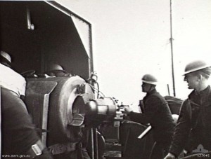 Crew of gunboat HMS Ladybird operating a 6-inch 50-caliber Mk XIII gun during the bombardment of Bardia, Libya, 2 Jan 1941 (Australian War Memorial: 127945)