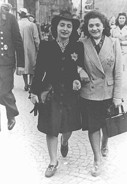 Rozetta Lezer Lopesdias-Van Thyn, left, and a friend, with the compulsory Star of David on their clothing. Amsterdam, the Netherlands, May 1942-1943 (US Holocaust Memorial Museum)