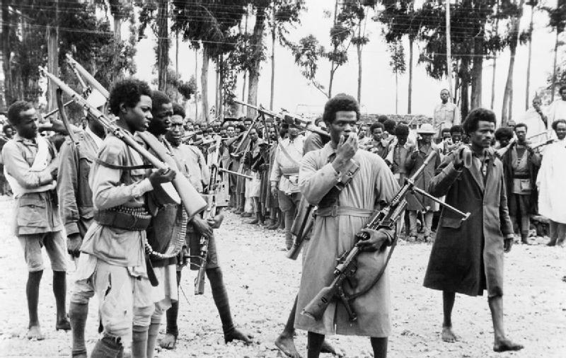 Ethiopian men gather in Addis Ababa to hear proclamation announcing return of Emperor Haile Selassie in May 1941 (Imperial War Museum: K 325)