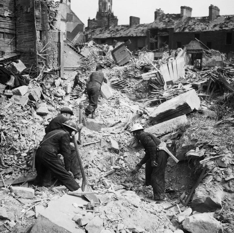 Rescue workers search through the rubble of Eglington Street in Belfast, Northern Ireland, after a German Luftwaffe air raid, 7 May 1941 (Imperial War Museum: H 9476)