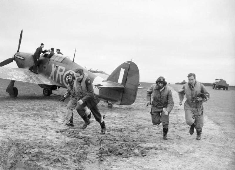 American pilots of No.71 “Eagle” Squadron rush to their Hurricanes at Kirton-in-Lindsey, 17 March 1941 (Imperial War Museum: CH 2401)