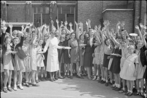 British schoolchildren receive plates of bacon and eggs, imported from America as part of the Lend-Lease program, Aug-Sept. 1941 (Imperial War Museum: D 4324)